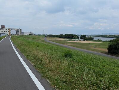 Biking along Yodo River with Torikai Bridge in the background